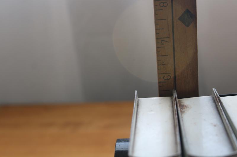 photo of 1940s vintage recipe card holder file box, shelf of little metal 'cookbooks' #2