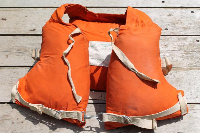 photo of 1950s vintage life preserver buoyant vest, kapok fill orange cotton life jacket #1