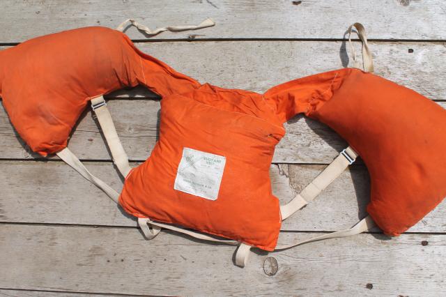 photo of 1950s vintage life preserver buoyant vest, kapok fill orange cotton life jacket #3