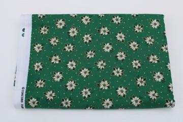 photo of 1990s vintage Christmas fabric, white poinsettias on green Kesslers print Concord fabrics cotton