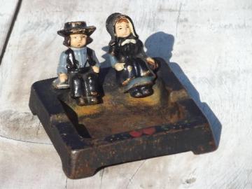 catalog photo of 40s vintage Wilton cast iron handpainted ashtray w/ Amish boy and girl