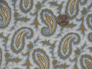 catalog photo of 60s vintage mustard yellow paisley print on blue, retro quilting fabric