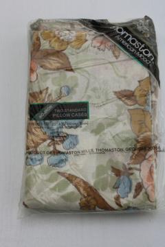 catalog photo of 70s 80s vintage pillowcases, natural muted colors floral print cotton blend, sealed original package 
