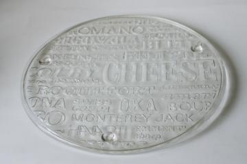 catalog photo of 70s mod vintage cheese board serving plate, minimalist clear glass cheese varieties embossed design 