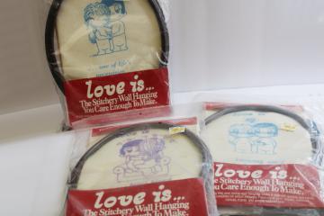 catalog photo of 70s vintage Love Is framed embroidery kits w/ yarn and printed canvas, retro Kim Casali art