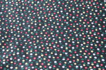 catalog photo of 70s vintage fabric, print cotton tiny flowers on black, prairie girl calico