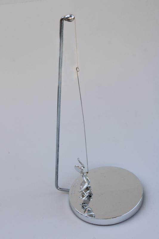 photo of 70s vintage kinetic sculpture, magnet pendulum perpetual motion skateboarder in mod chrome #6