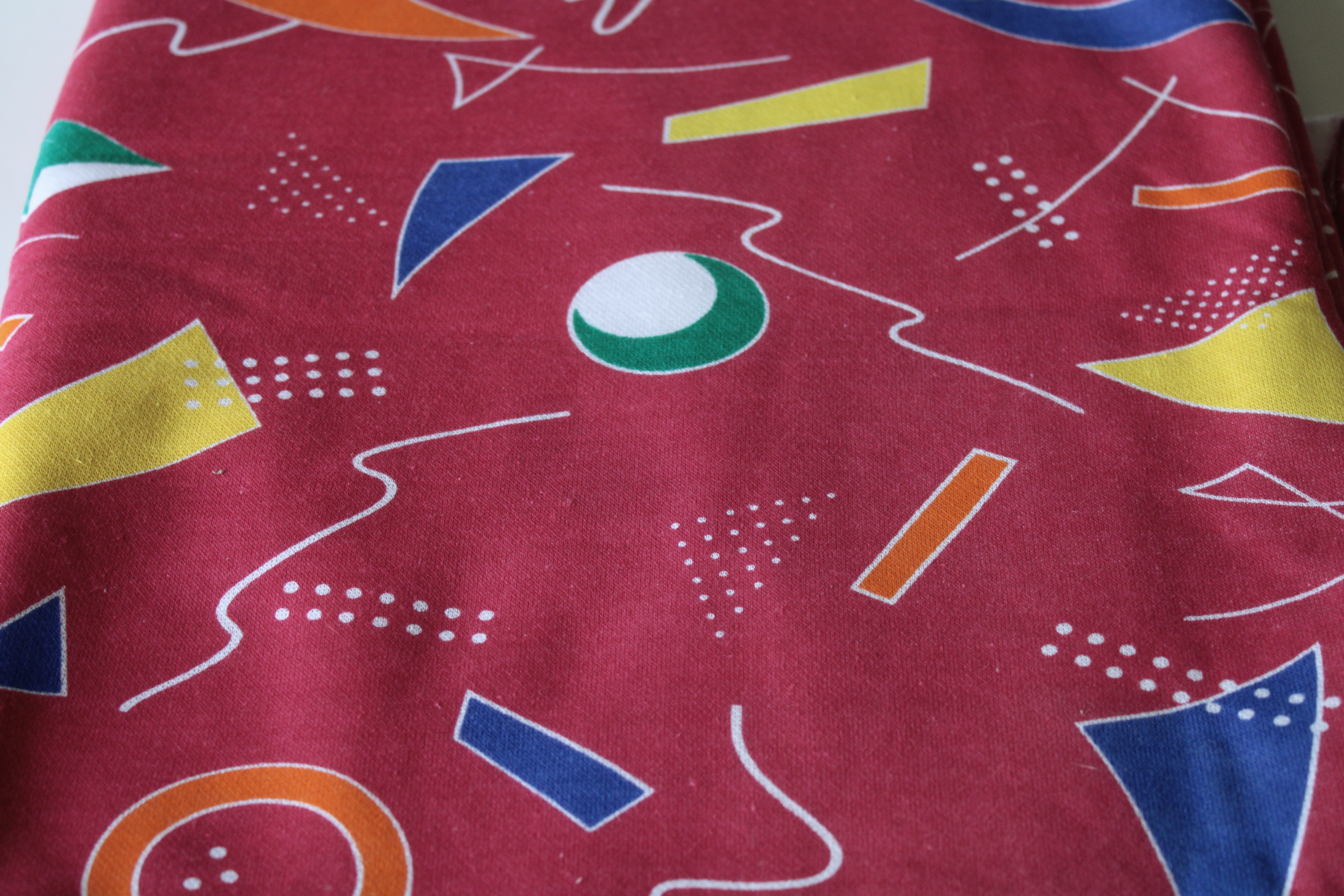 photo of 80s 90s vintage sweatshirt fleece knit fabric, colorful retro shapes Memphis design #1