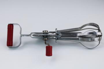 catalog photo of AJ Ekco eggbeater, hand crank rotary mixer w/ red bakelite handles, 1940s or 50s vintage