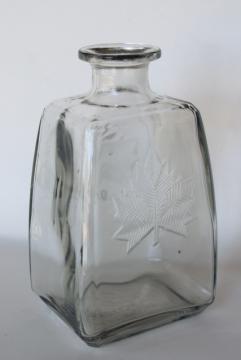 photo of Canada maple leaf vintage embossed glass liquor bottle decanter McNaughton whiskey