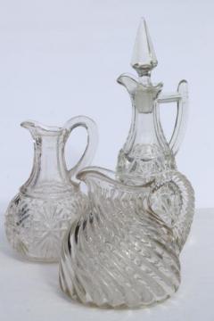 catalog photo of EAPG vintage pattern glass cruet bottles, heavy old glass pitchers, antique Fostoria jug