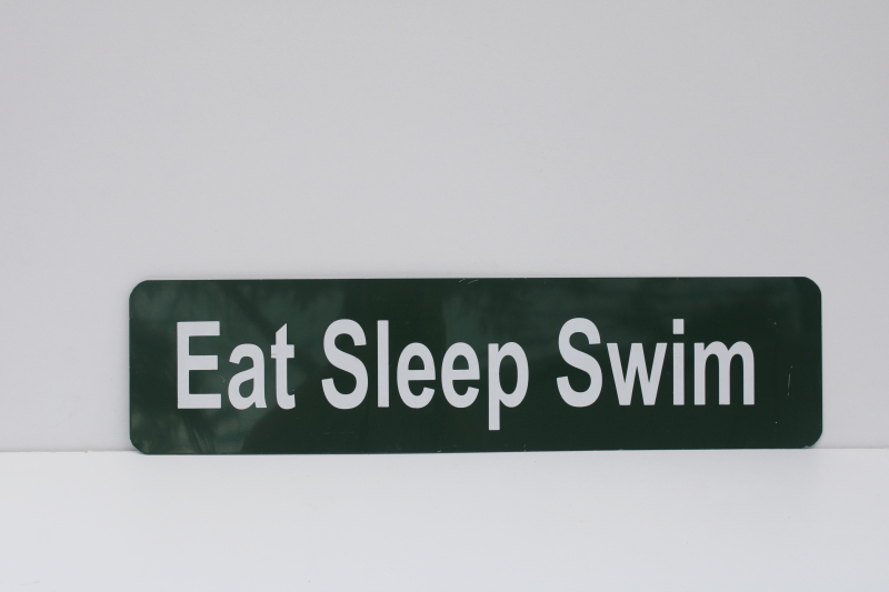 photo of Eat Sleep Swim green & white metal sign, modern camp cabin lake vacation house wall art  #1