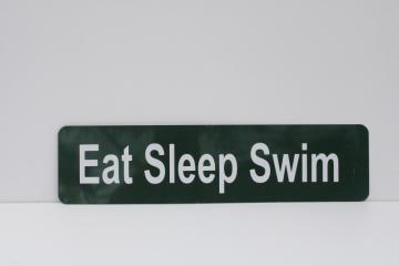 catalog photo of Eat Sleep Swim green & white metal sign, modern camp cabin lake vacation house wall art 