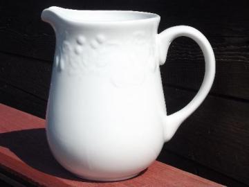 catalog photo of Gibson pottery milk pitcher, raised fruit border on glossy white