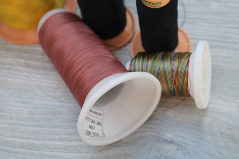photo of Gutermann Japan cone thread lot, silky polyester machine embroidery thread Madeira type #4