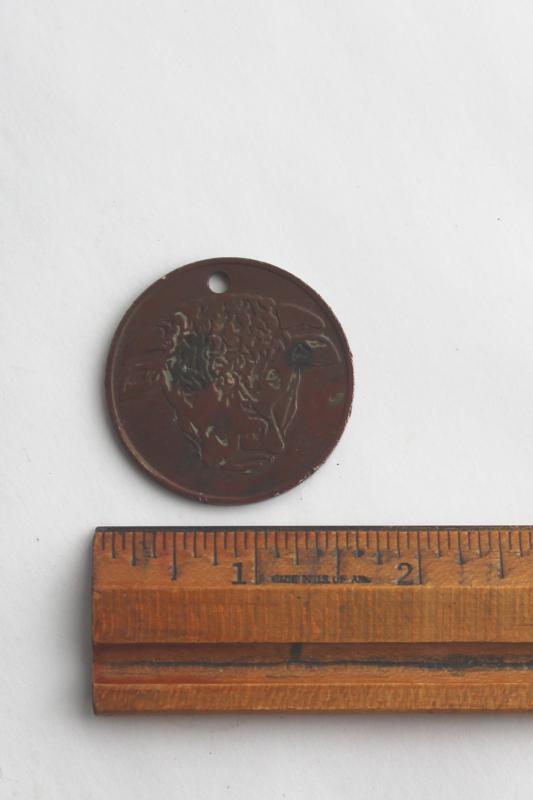 photo of Hereford's Whiskey You Pay token, tarnished copper color coin w/ Hereford cow or bull #2