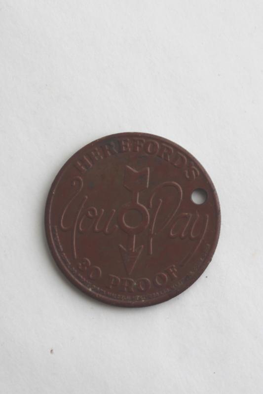 photo of Hereford's Whiskey You Pay token, tarnished copper color coin w/ Hereford cow or bull #5