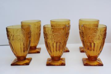 catalog photo of Indiana daisy pattern vintage amber depression glass footed tumblers, drinking glasses