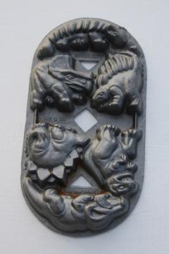 catalog photo of John Wright cast iron cakelet pan, dinosaur shapes mini cakes mold