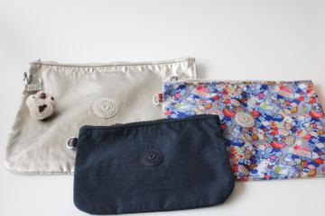 catalog photo of Kipling nylon zip bags creativity pouches navy blue, colorful print, silver w/ monkey charm