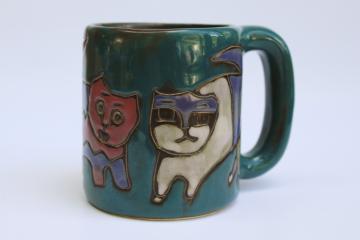 catalog photo of Mara Mexico stoneware pottery mug, arty funky cats design on teal glaze ceramic 