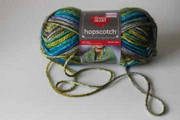 catalog photo of Red Heart Hopscotch yarn Kickball colorway varigated blue aqua olive yellow greens w/ grey 