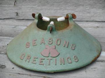 catalog photo of Season's Greetings old cast iron Christmas tree stand, green and red