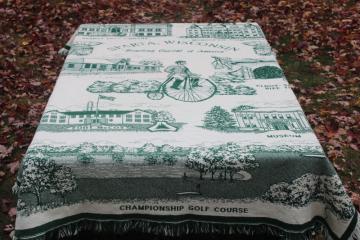 catalog photo of Sparta Wisconsin souvenir blanket, woven throw w/ bike trail town landmarks, Ben Bikin 