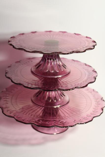 photo of amethyst pink colored glass cake stands, scalloped edge laurel vines, tower of graduated sizes #10