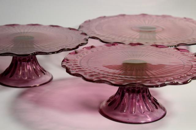 photo of amethyst pink colored glass cake stands, scalloped edge laurel vines, tower of graduated sizes #11