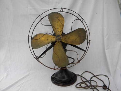 photo of antique Century 16 in brass blade oscillating fan w/wire cage and 1914 patent #1