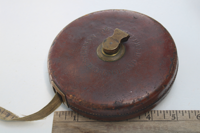 photo of antique Chesterman 100 foot cloth tape measure in leather case, brass hand crank winding reel #1