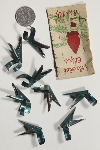 photo of antique Christmas tree light bulb holders, metal spring clips on original paper card #2