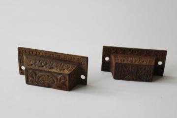 catalog photo of antique Eastlake cast iron drawer bin pull, two different patterns vintage hardware lot