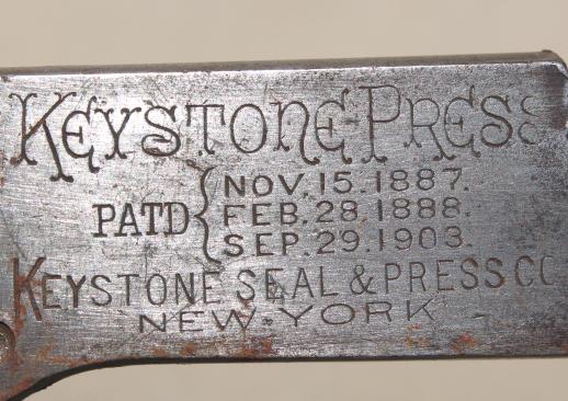 photo of antique  Keystone Press sealer tool for pressing lead packing seals, vintage railroad tool w/ 1800s patents #7