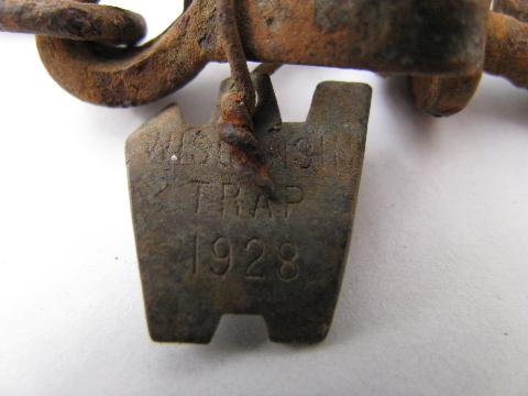 photo of antique Wisconsin copper trap tags 1928 and 1948 fur trapping #2