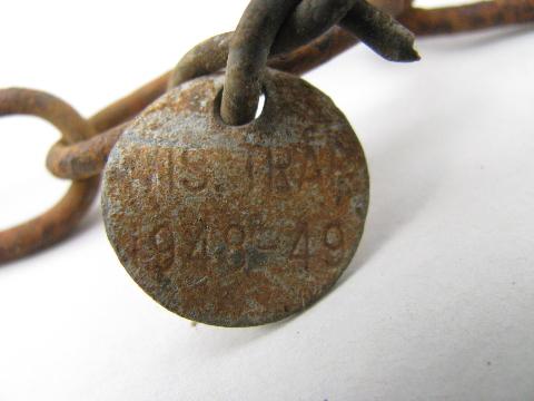 photo of antique Wisconsin copper trap tags 1928 and 1948 fur trapping #3