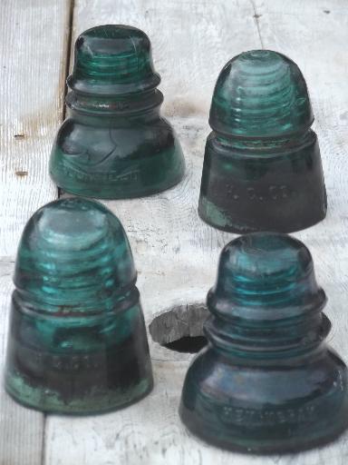 photo of antique aqua blue green glass telegraph or electrical insulators #1