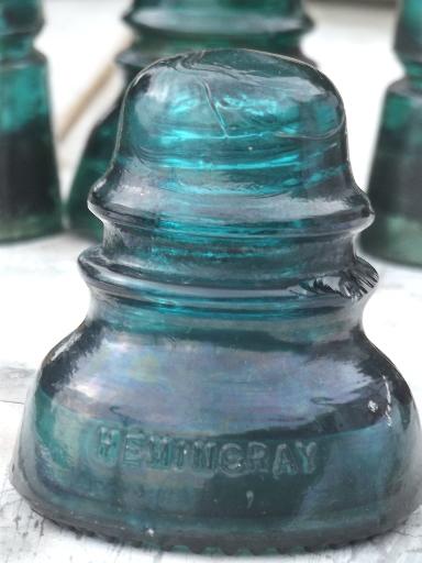 photo of antique aqua blue green glass telegraph or electrical insulators #2