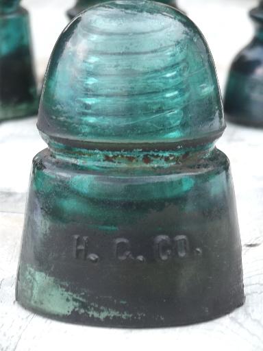 photo of antique aqua blue green glass telegraph or electrical insulators #3