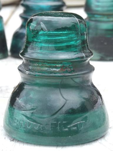 photo of antique aqua blue green glass telegraph or electrical insulators #4