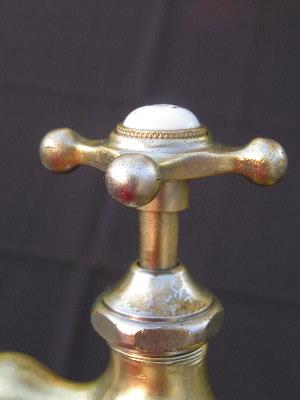 photo of antique brass and china faucet taps #4