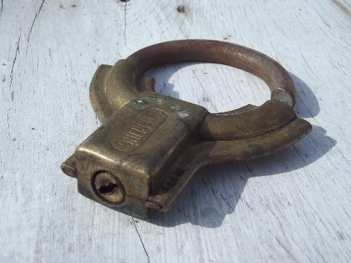 photo of antique brass padlock, Old brass circular padlock Sterling Lock Co, Minn #3