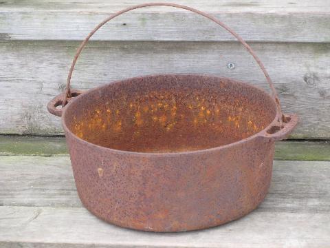 photo of antique cast iron kettle, bean or stew pot for campfire and wood stove #1