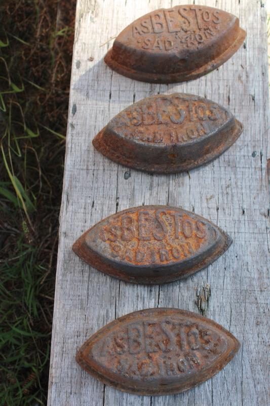 photo of antique cast iron sadirons, Asbestos brand irons, rusty junk primitive door stops #1