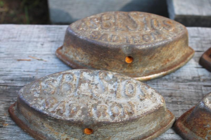 photo of antique cast iron sadirons, Asbestos brand irons, rusty junk primitive door stops #3