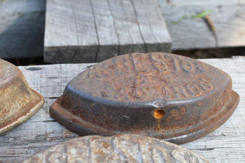 photo of antique cast iron sadirons, Asbestos brand irons, rusty junk primitive door stops #4