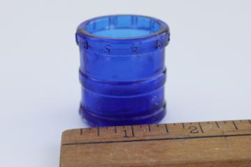 catalog photo of antique cobalt blue glass medicine dose cup measure from Wyeth pharmacy bottle