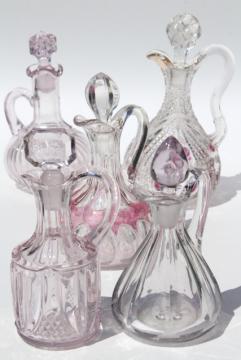 catalog photo of antique cruet bottles, sun purple / cranberry stain EAPG pressed pattern glass cruets