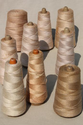 photo of antique ecru tan faded brown colors primitive grubby old spools of vintage cotton cord thread #1